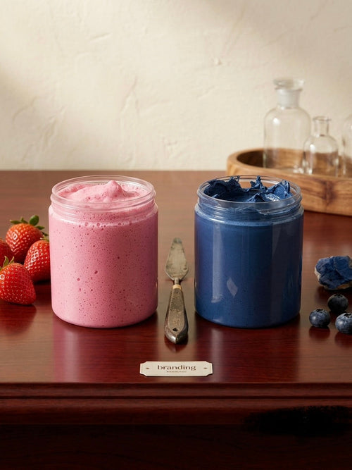 Butter Slime in strawberry pink and blueberry blue jars